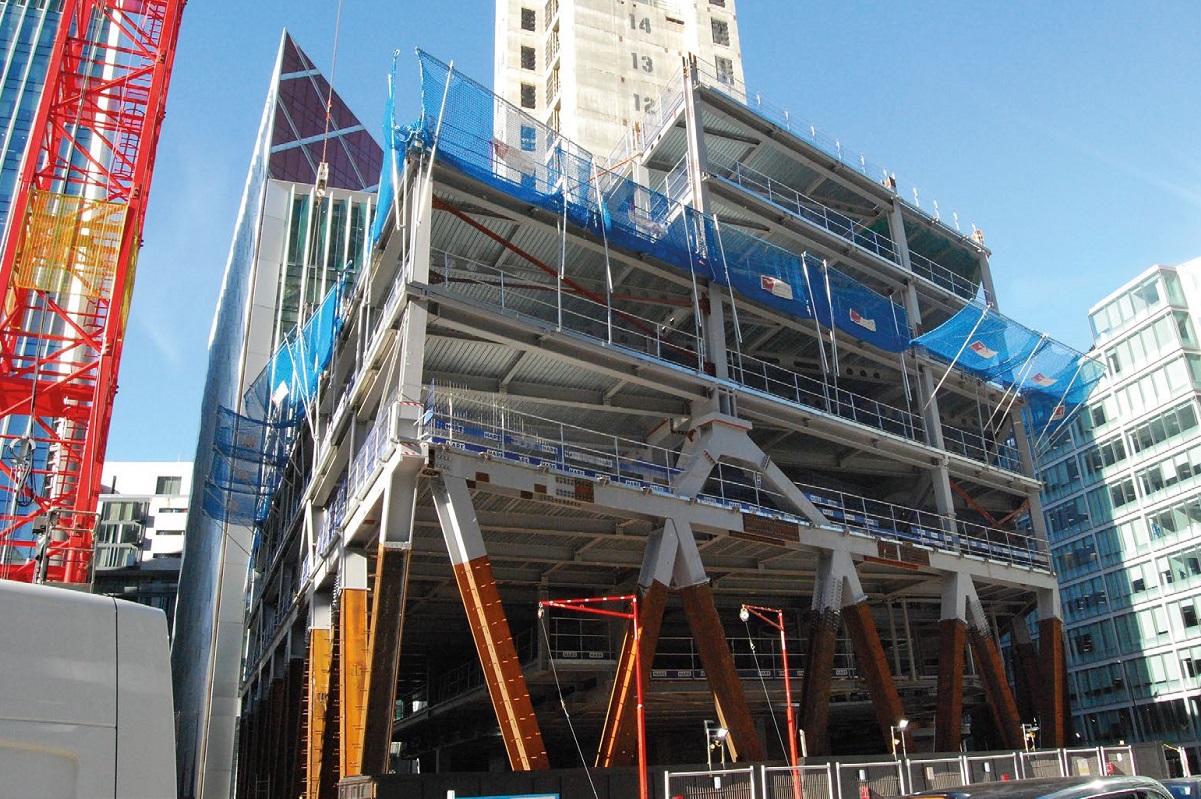 The ground floor trusses incorporate architectural V-shaped diagonal steel members