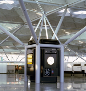 Simple group of four columns and inclined tubular arms used to support the roof of Stansted Airport