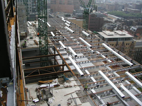 Rapid installation of steel decking on long span beams