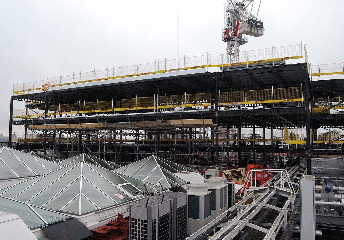 The steelwork is being erected around existing plant and roof lights, that are to be incorporated into the new design