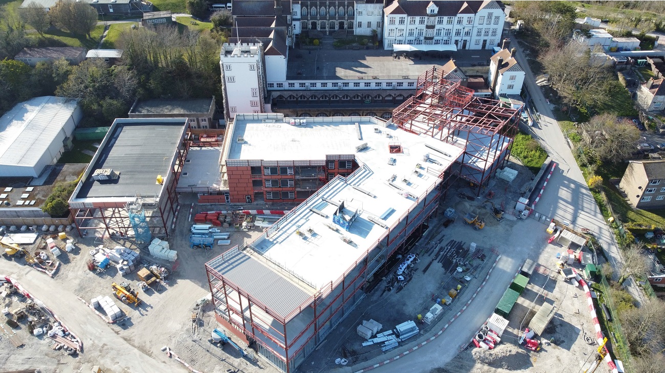 The school is located in a prominent position overlooking the town