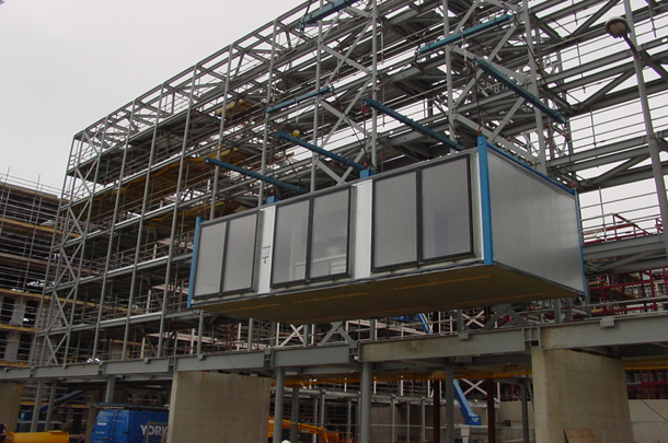 Installation of modules behind external steel framework at MoHo, Manchester (Image courtesy of Portakabin and Joule Consulting Engineers)