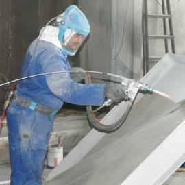 Gas (flame) spraying aluminium to steel bridge component (Image courtesy of Metallisation)