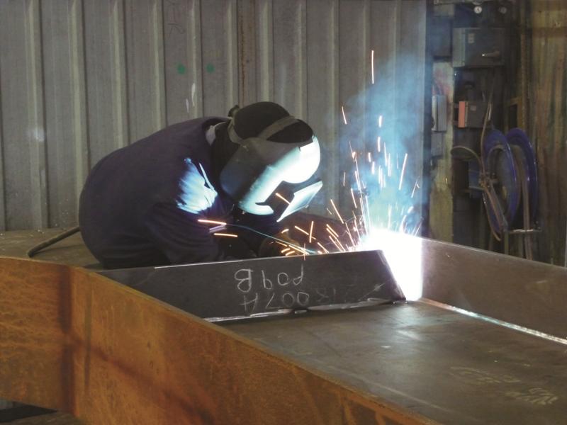 Welding stiffeners onto a large fabricated beam (Image courtesy of Mabey Bridge Ltd)