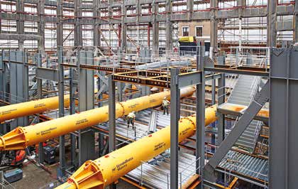 Temporary props support the basement while the new frame is erected