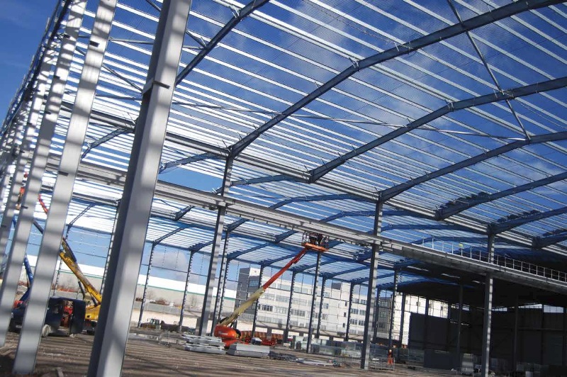 A maintenance gantry is supported by a central row of columns