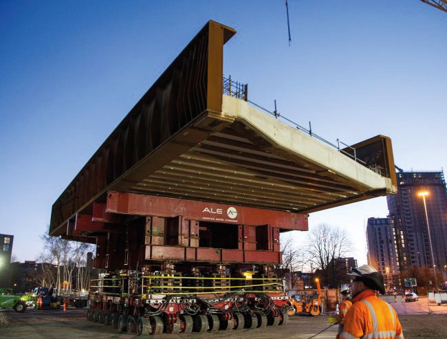 One of the Water Street bridges is transported to its final position