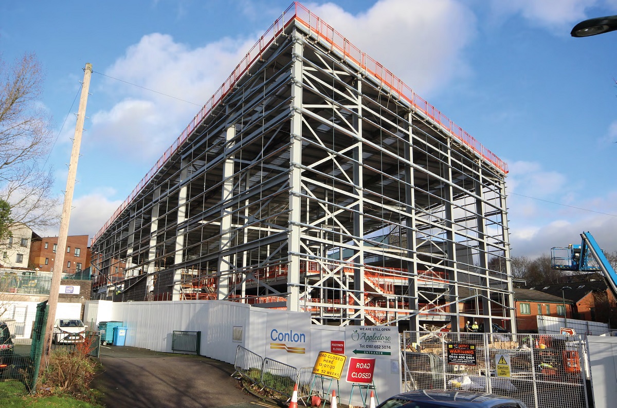 The steel frame incorporates the sloping site into its overall design