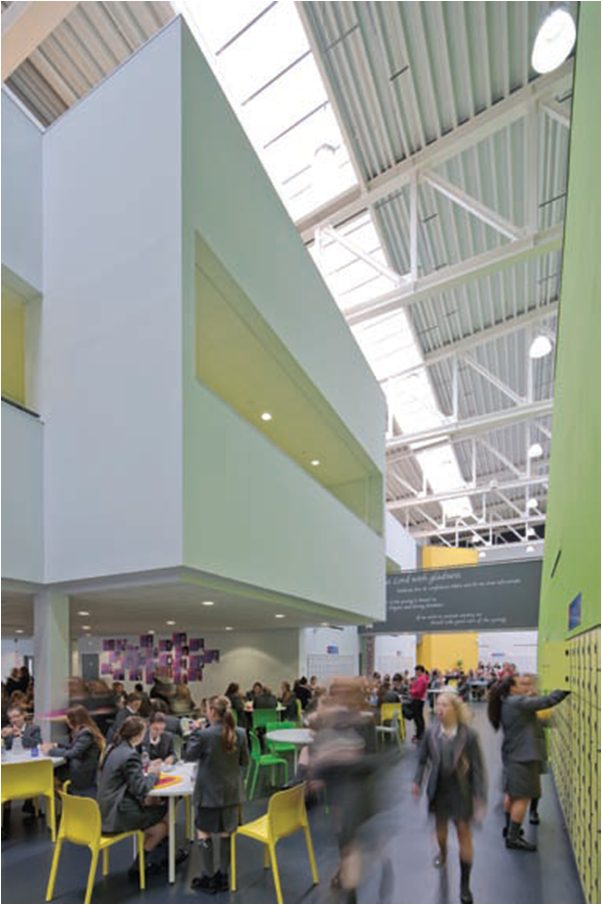 Roof lights bring light into the heart of the deep plan, with the steel roof trusses clearly visible