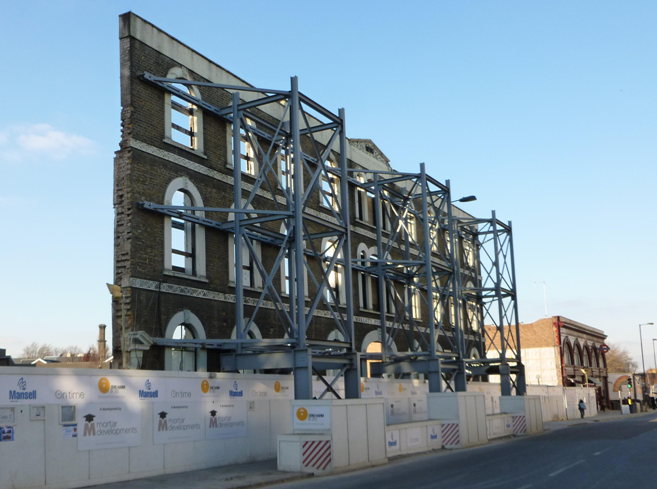 Existing brickwork supported by a temporary steel structure