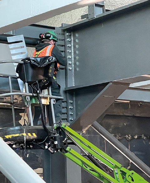 Tricky bolted connections, for the new steelwork, are made close to the existing structure