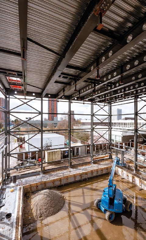 Metal decking and a concrete topping supported by cellular beams forms the structure's uppermost level