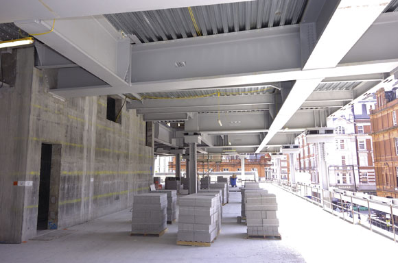 In order to support the residential zones’ smaller grid pattern a transfer structure has been installed at second floor level