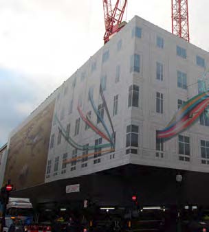 Hoardings cover the façades and hide the construction work