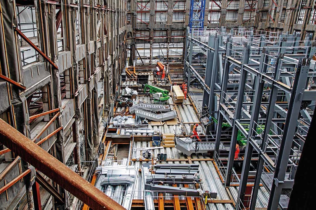 The new frame rises up within the retained façades
