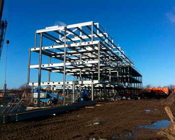 The steel frame is supported on piled foundations
