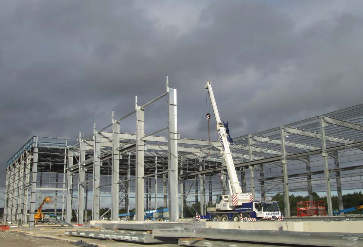 Steel for the MBT is erected by a crane positioned within the building’s footprint