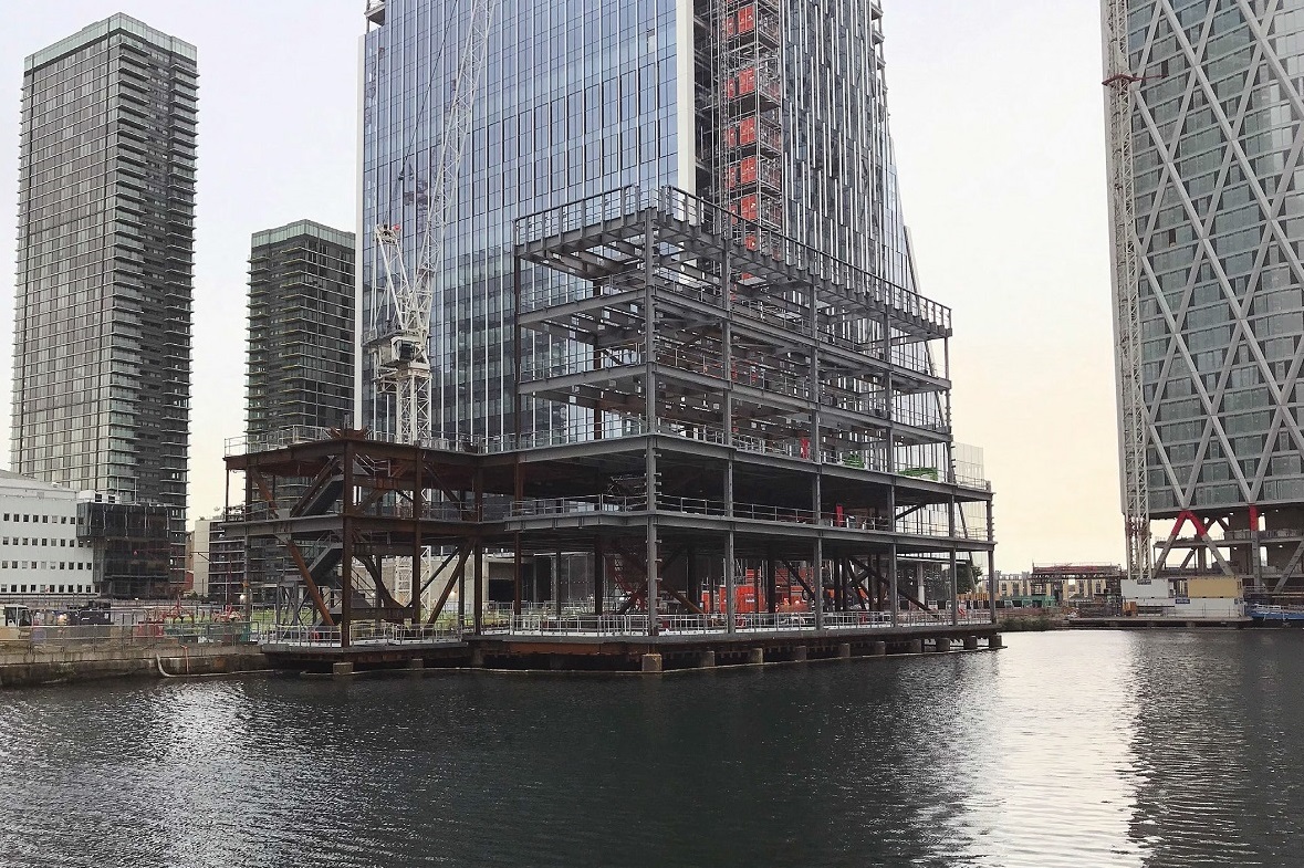 The structure sits over a dock and reuses existing piles