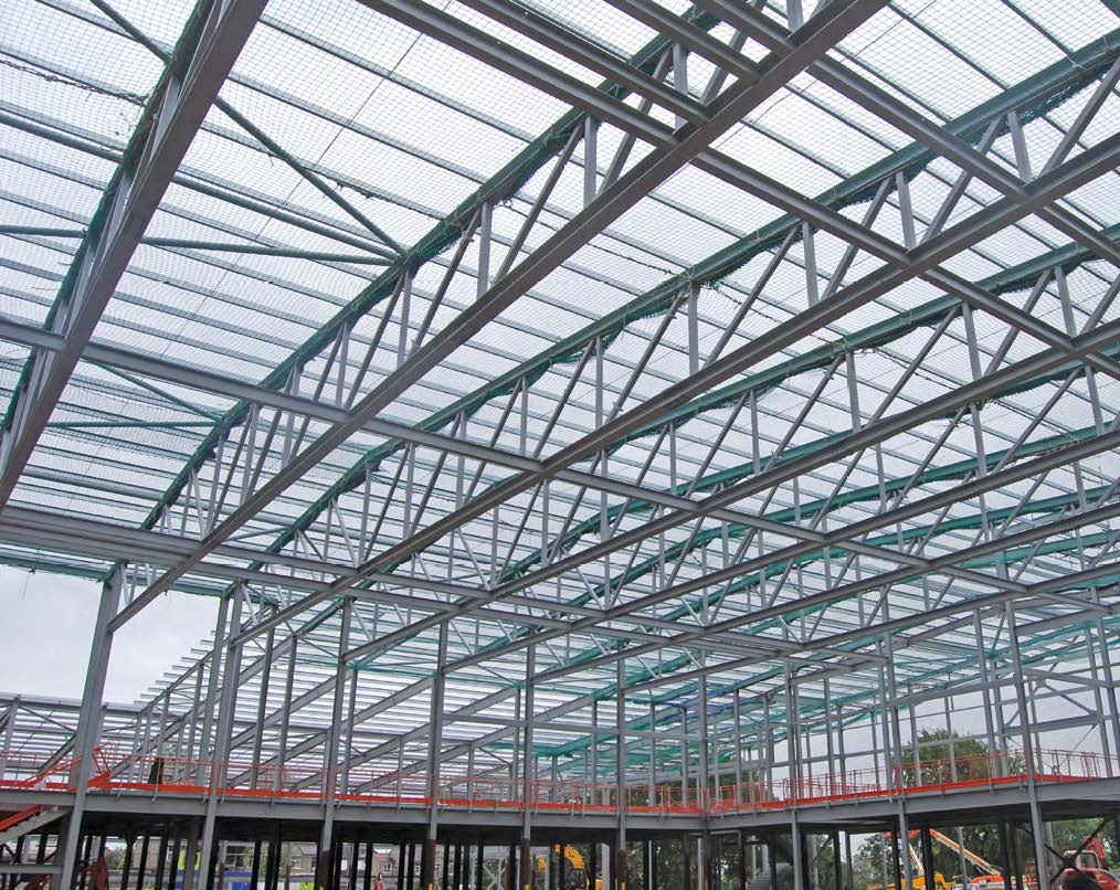 A series of 45m-long trusses spans the sports hall