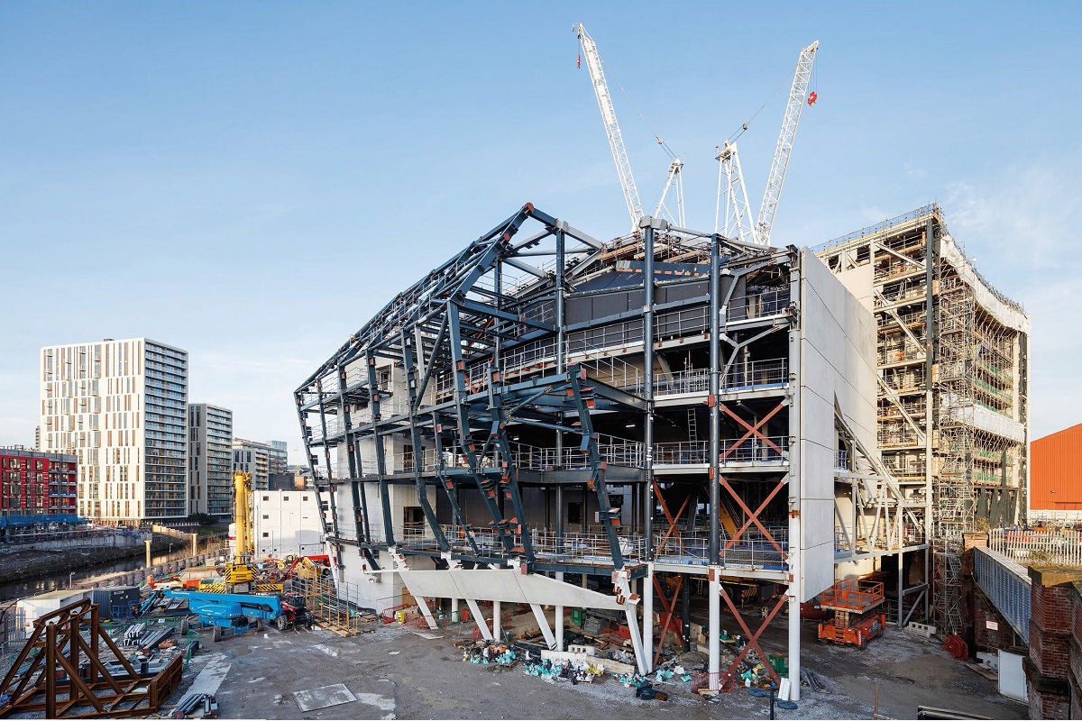 Cranked steel members form the building's signature curved facade