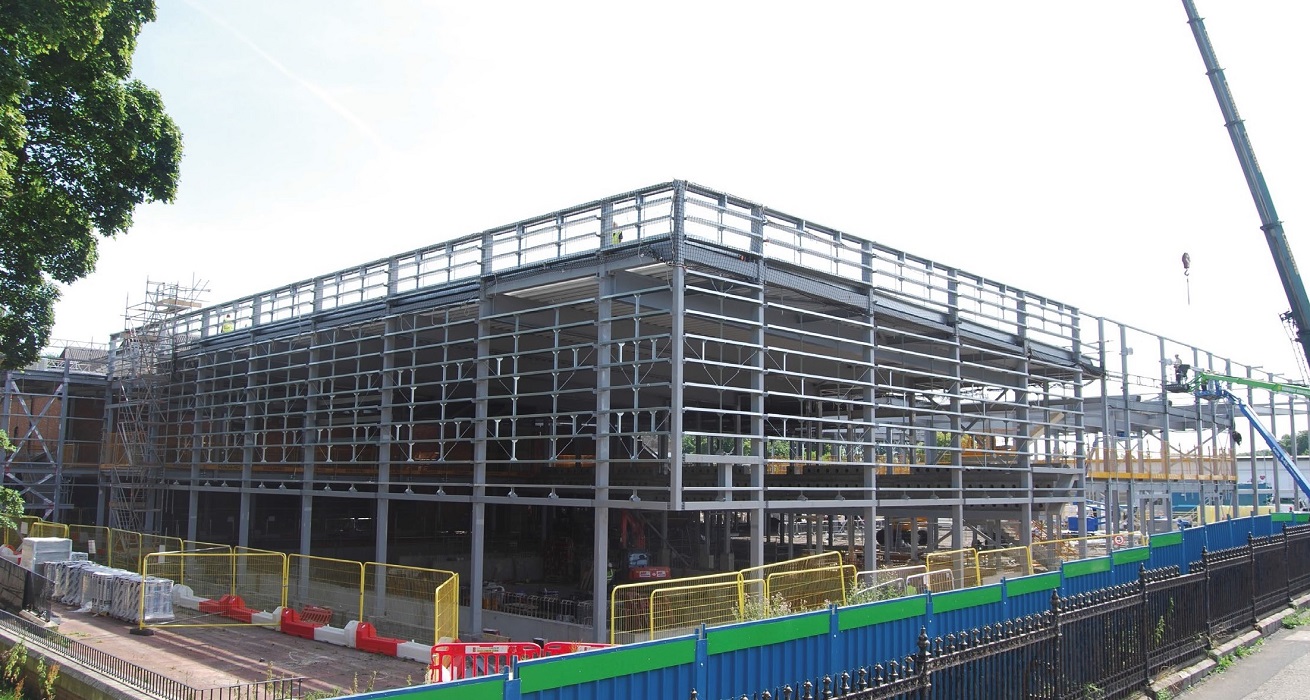 A steel-framed solution was chosen because the material could economically form the required long internal spans