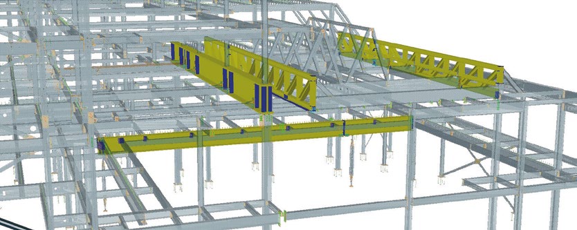Roof trusses span the main hall, while a large plate girder supports the residential floors above