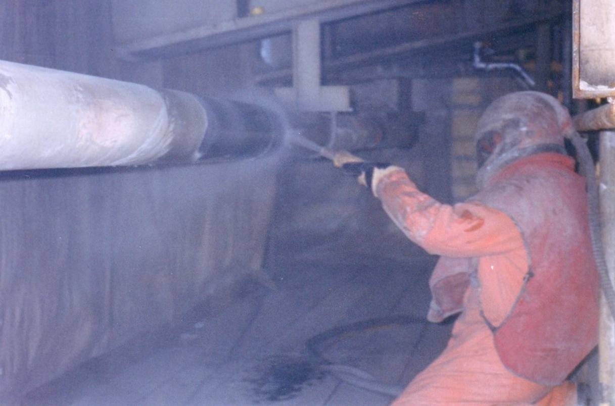 Wet abrasive blast cleaning