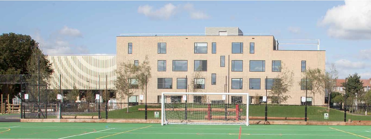 Rear elevation of the main school building, showing the sports beam (left) and the main brick-clad school building