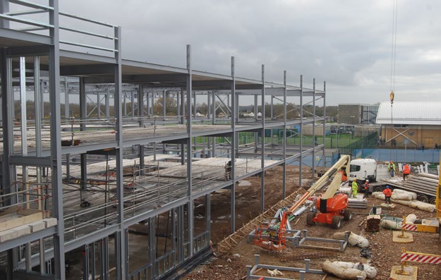 Steelwork goes up in front of Longdean’s retained sports hall