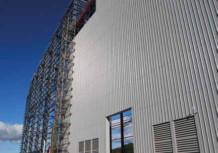 Cladding proceeds on the main process building