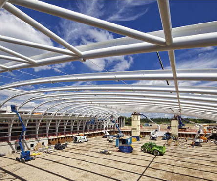 Curved members supporting a series of slender CHS trusses