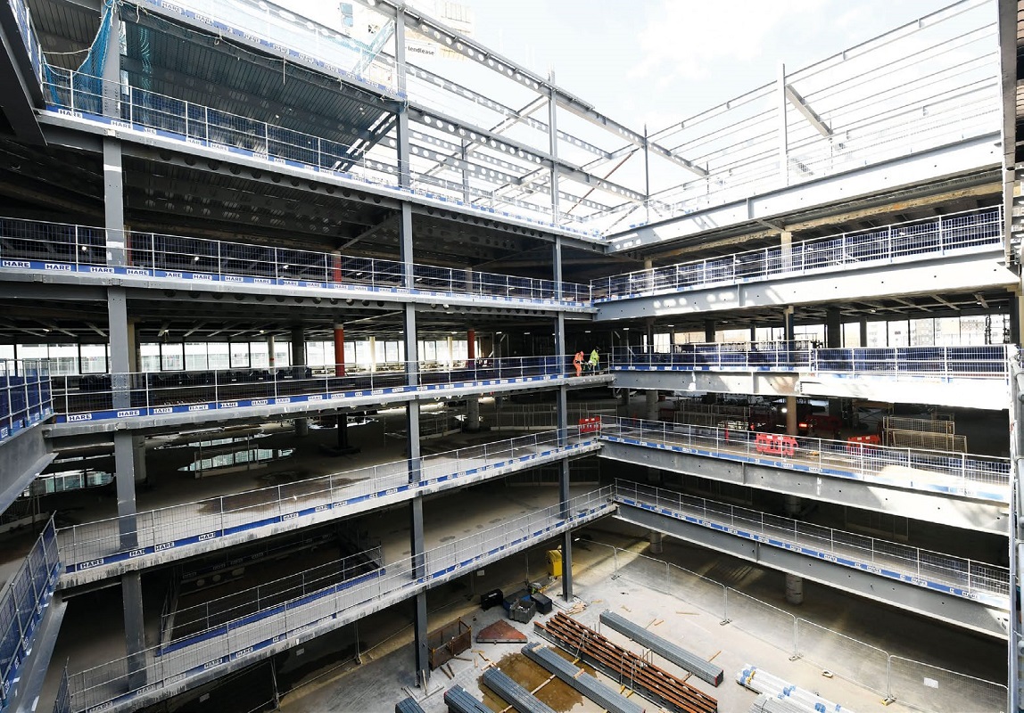 New steelwork partially infills some of the atrium, creating a smaller void