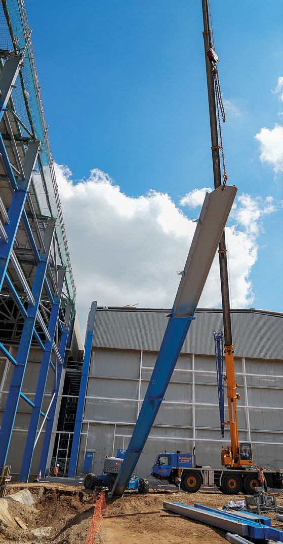 The extension follows the same column grid pattern of the existing building