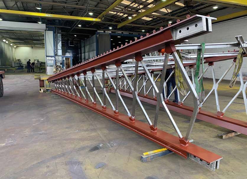 The steel assemblies have finger joints that connect with adjoining sections