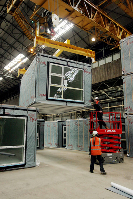 Module being lifted in the factory