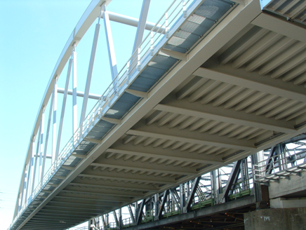 Orthotropic steel deck for a tied arch bridge