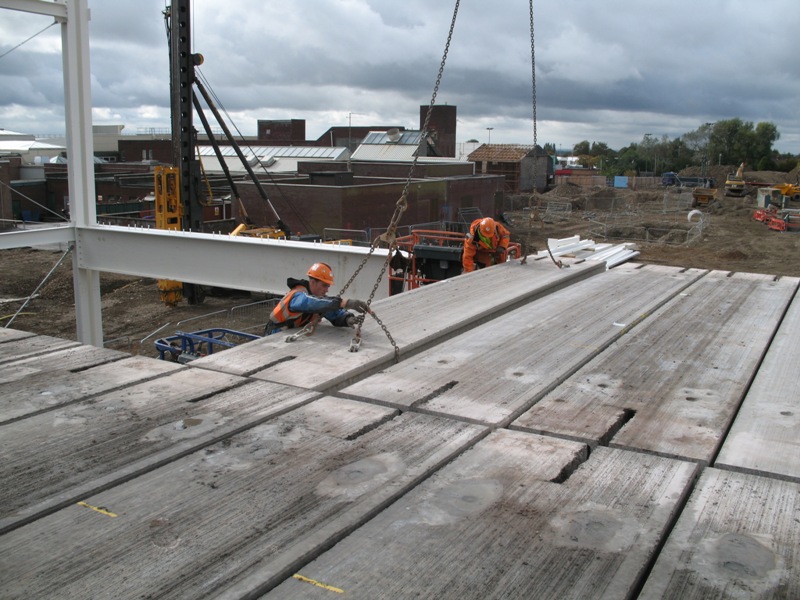 Erecting precast floor slabs on a steel frame (Image courtesy of Severfield (Design & Build) Ltd.)