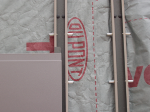 Large colour coated steel cassette panels supported on vertical rails