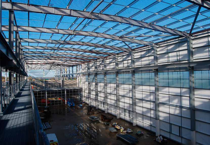 The straw barns sit end-to-end