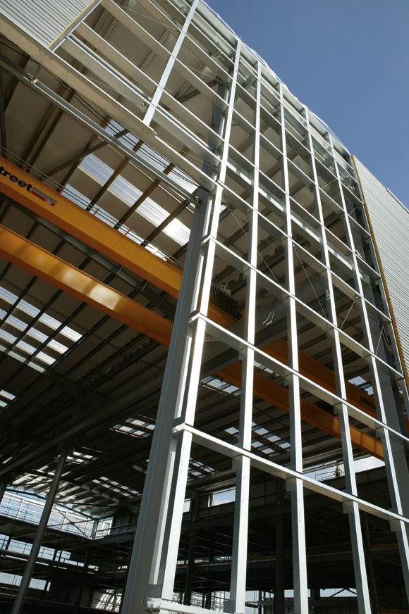 All three halls feature a large overhead crane suspended from the steelwork
