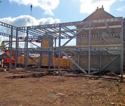 The steel frame erection begins