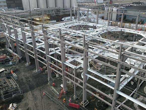 The steel mezzanine level has holes through which brewing vessels will protrude