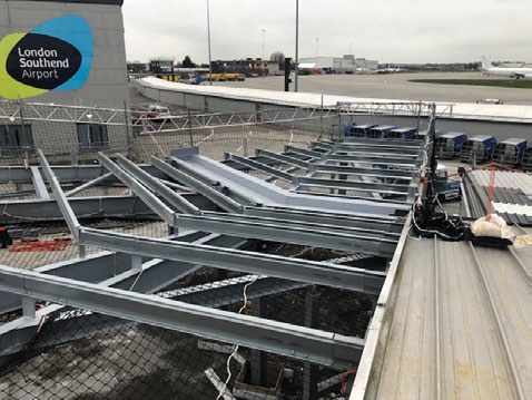 Construction work is being carried out around the activities of a live airport