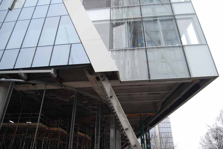 The building cantilevers over a pedestrian thoroughfare