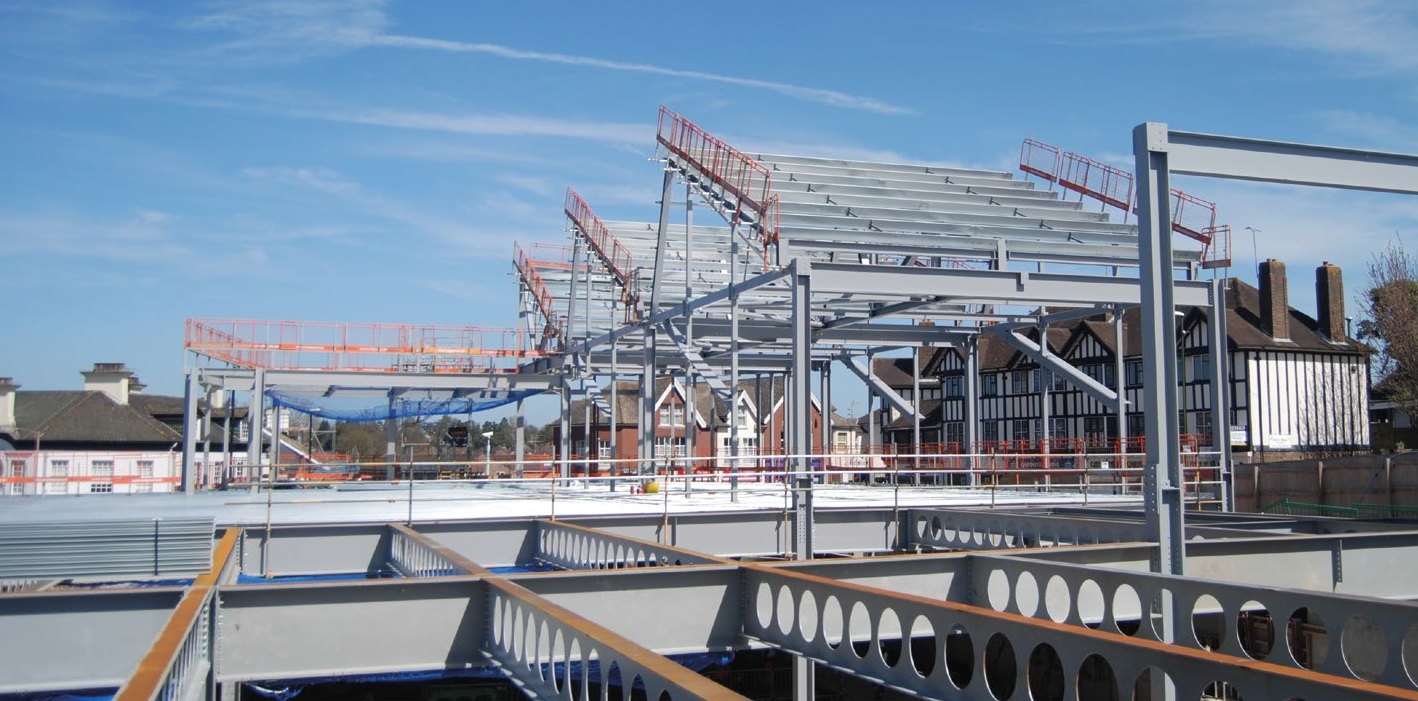 Sitting atop the store are the saw-toothed roofs of the back-of-house facilities