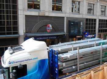 Unloading steel outside of Monument station